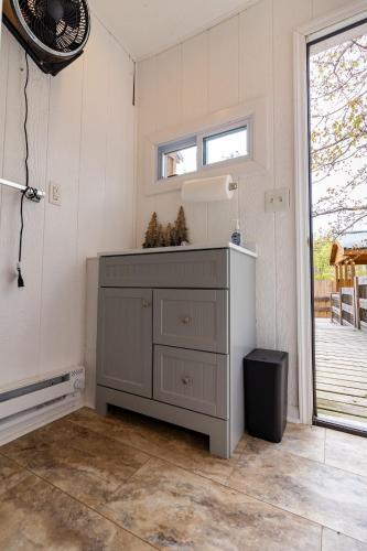 a kitchen with a dresser in the corner of a room at Timber Ridge Retreat in Morton Grove