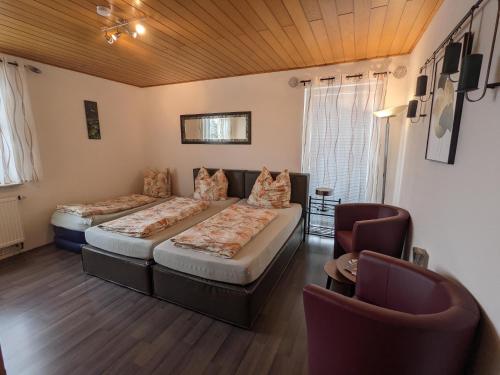Postel nebo postele na pokoji v ubytování Ferienwohnung im Grünen I