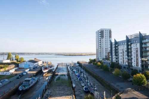 an aerial view of a city with a river and buildings at 1BR - Stunning 5th-Flr Views - Sleeps 4 - Parking in Hoo