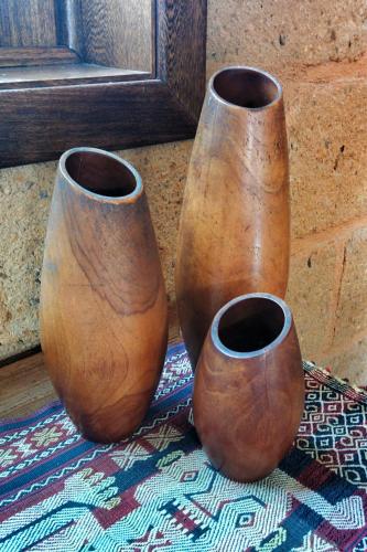 three brown vases sitting on a rug at Hotel Casa San Pancho in San Francisco
