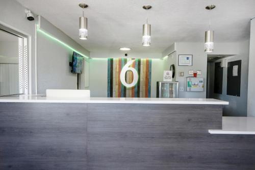 a bar in a hospital with a green light at Home 6 by Townhouse Topeka KS I 70 in Topeka