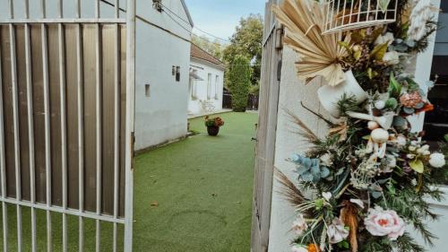 a gate with a wreath on the side of a house at Nest and Rest in Cluj-Napoca