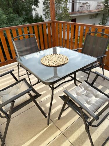 a blue table and two chairs on a deck at Dom Gościnny Ania, Apartament nr 6 in Wisełka