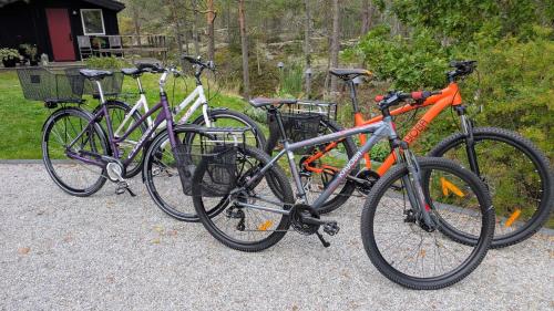 three bikes are parked next to each other at 5-star homestay for 2 with breakfast, hot-tub, aircon and bikes in Ingarö