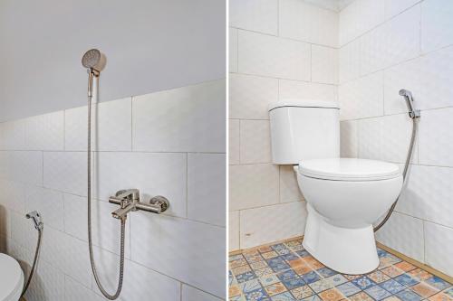 a bathroom with a toilet and a shower at Collection O Subang near Ciater Subang formerly Orchid Villa Ciater in Ciater