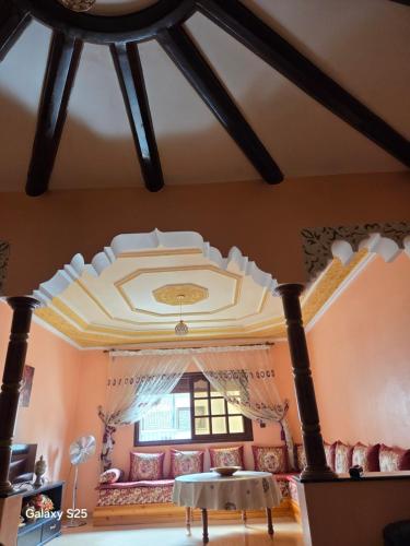 a living room with a couch and a ceiling at Leila in Agadir
