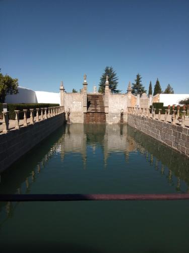 a pool of green water in a canal in a castle at VISIt CASTELO BRANCO in Castelo Branco