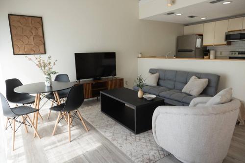 a living room with a couch and a table at 3-Bed Coastal Comfort in Biloxi in Gulfport