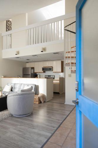 a living room with a couch and a kitchen at 3-Bed Coastal Comfort in Biloxi in Gulfport