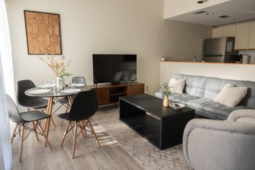 a living room with a couch and a table at 3-Bed Coastal Comfort in Biloxi in Gulfport
