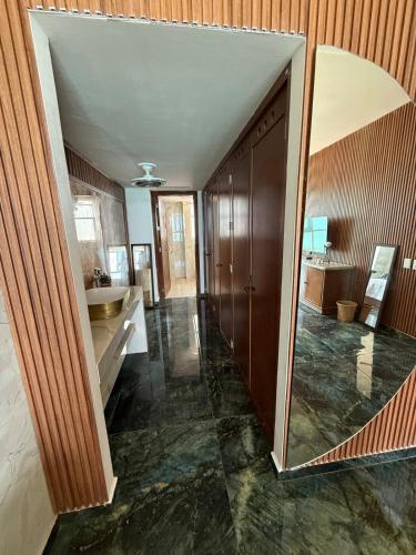 a bathroom with a sink and a mirror at Renta de Depto, Acapulco Gro, Torre Palladio in Acapulco