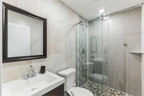 a bathroom with a sink toilet and a shower at Large 2BR in Old City that Sleeps 8 in Philadelphia