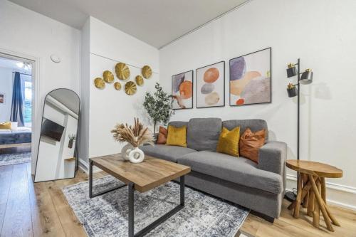 a living room with a couch and a table at Quaint and Cozy Center City 1BR that Sleeps 4 in Philadelphia