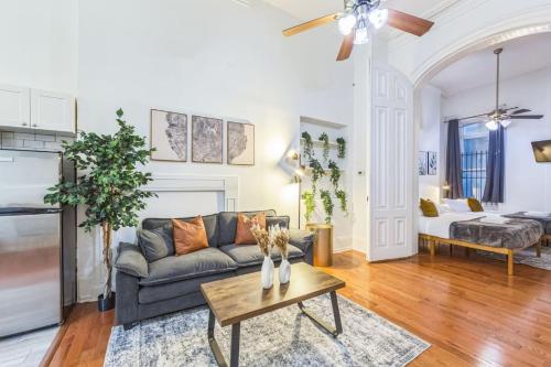 a living room with a couch and a table at Large Historical Center City 1BR that Sleeps 4 in Philadelphia