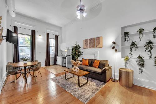 a living room with a couch and a table at Large Historical Center City 1BR that Sleeps 4 in Philadelphia