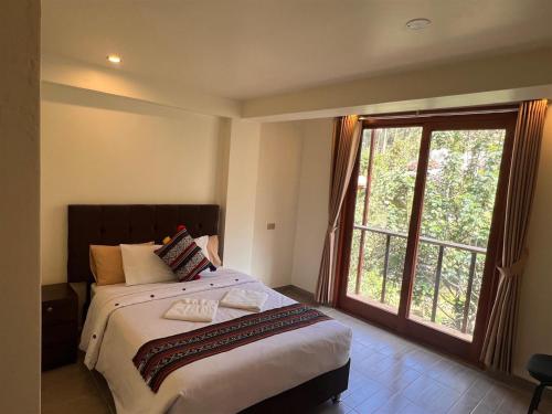Ένα ή περισσότερα κρεβάτια σε δωμάτιο στο Hotel Humantay lodge Ollantaytambo
