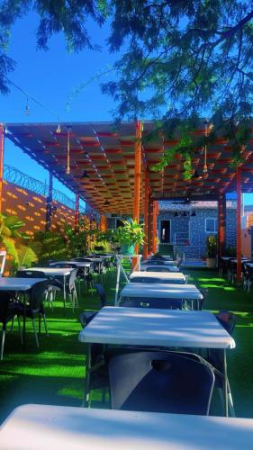 a row of tables and chairs in a restaurant at Pereira lounge bar in Praia