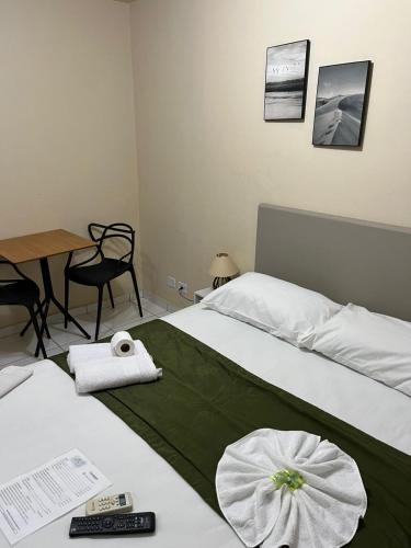 Una cama o camas en una habitación de Hotel Morada de Leste Pontal
