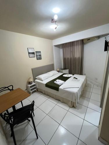 Una cama o camas en una habitación de Hotel Morada de Leste Pontal
