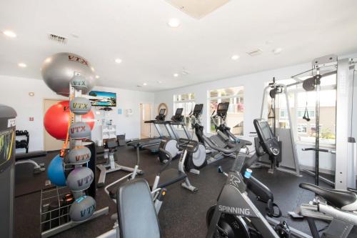 a gym with several treadmills and cardio machines at Beachcomber 03 in George Town