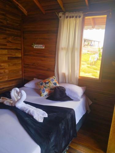 Postel nebo postele na pokoji v ubytování Gran Vista Glamping Curití