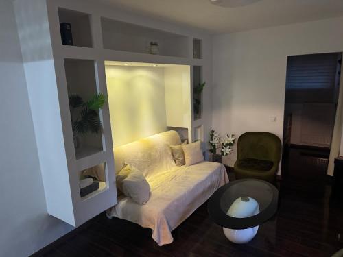 a living room with a couch and a table at Juicy Private Apartments with Jacuzzi in Szentendre