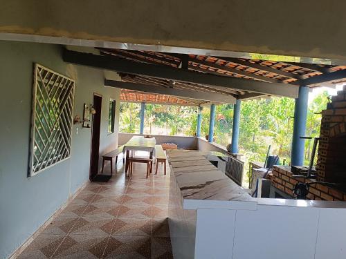 a patio with a table and chairs on a house at Paulo Sérgio Martins guerreiro in Benevides