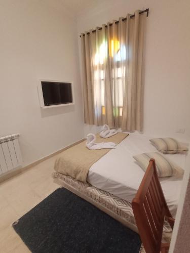 Katil atau katil-katil dalam bilik di Hôtel Al Jazira Mahdia