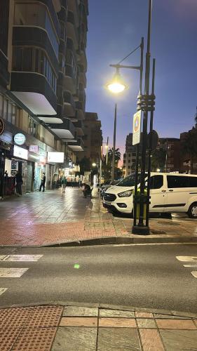 a city street with cars parked on the street at Capitán - 2 habitaciones centro de Fuengirola in Fuengirola