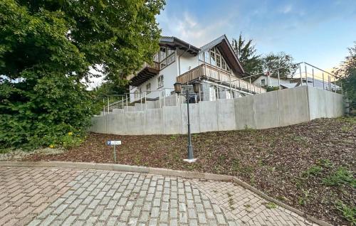 a house with a stone driveway in front of it at Nice Apartment In Südharz With Sauna in Stolberg i. Harz