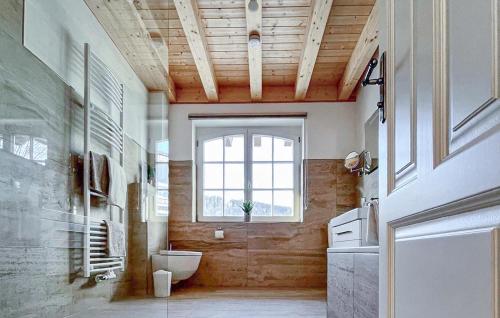 a bathroom with a toilet and a window at Nice Apartment In Südharz With Sauna in Stolberg i. Harz
