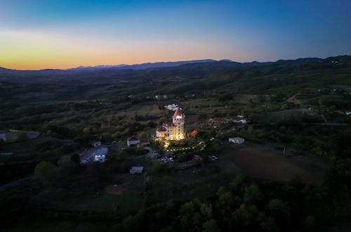 an aerial view of a building in the middle of a forest at Keshtjella Duka in Rrëshen