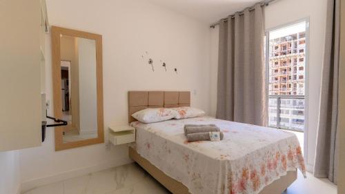 Ένα ή περισσότερα κρεβάτια σε δωμάτιο στο 2Q Novinho! Na 2ª quadra do mar!