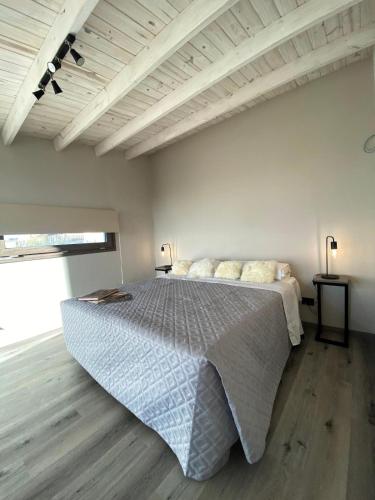a bedroom with a large bed in a room at Merinos Lodge 1 in El Calafate