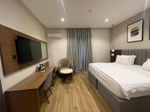 Ένα ή περισσότερα κρεβάτια σε δωμάτιο στο CheckInn Hotel Yola