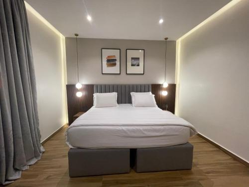 Ένα ή περισσότερα κρεβάτια σε δωμάτιο στο CheckInn Hotel Yola