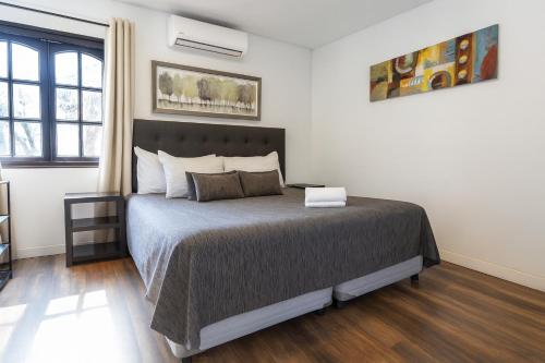 a bedroom with a large bed in a room at De Blasis Budget Rooms in Santiago