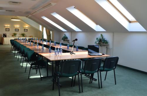 a large conference room with a long table and chairs at Hotel Pod Złotą Różą in Kielce