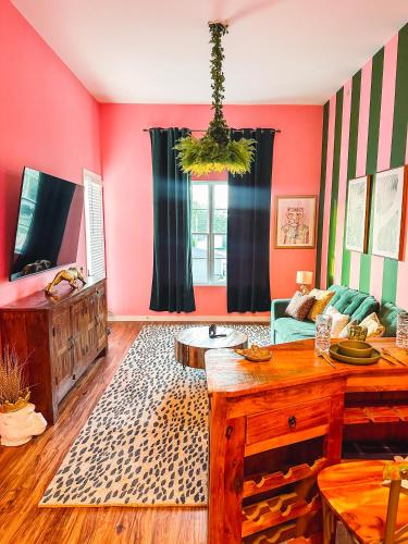 a living room with a couch and a table at Dreaming With Dolly - Luxe Stay Near Broadway in Nashville