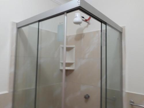 a shower with a shower head in a bathroom at Departamento a 1 cuadra de la Plaza Principal in Sucre