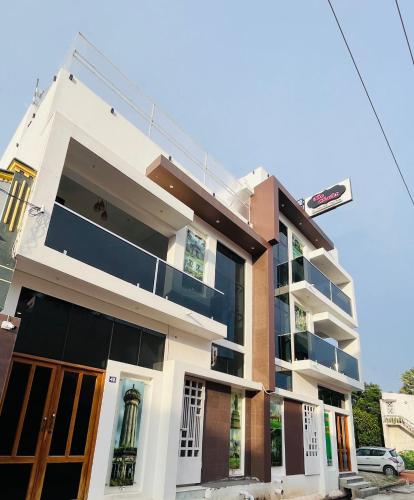 a building with a street sign in front of it at The Chalet - Cozy Villa with Mini Pool, near Eden Blue Flag Beach, Pondicherry - JR Groups in Puducherry