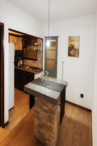 a kitchen with a island in the middle of a room at Serena in Maldonado
