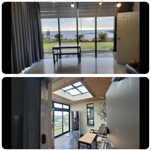 a room with a table and a view of the ocean at Beach Sunset in Jeju