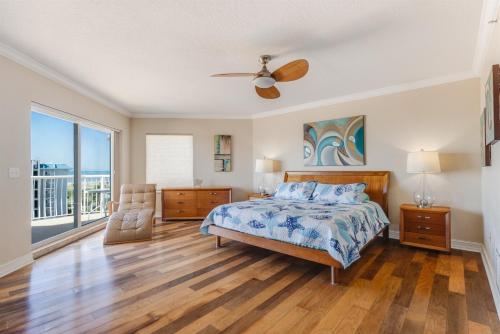 a bedroom with a bed and a ceiling fan at 3BR Luxury Penthouse Panoramic Views in St Pete Beach