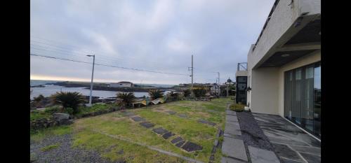 a house with a view of the water at Beach Sunset in Jeju