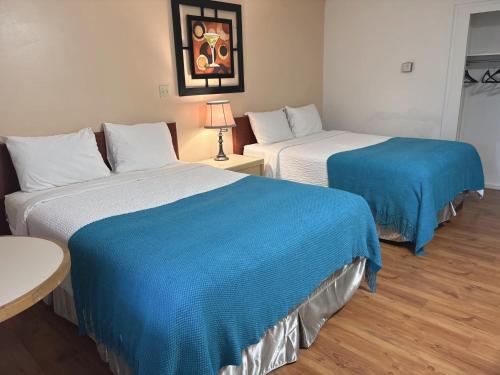Ένα ή περισσότερα κρεβάτια σε δωμάτιο στο Slumber Lodge
