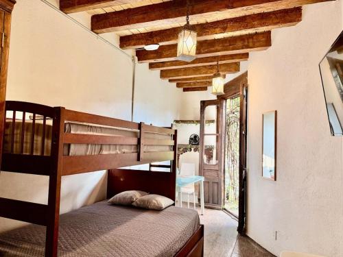 a bedroom with a bunk bed in a house at Tizapan 04 NEW 1BE&1BA in Mexico City