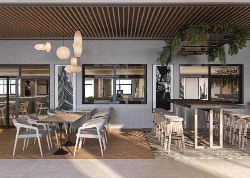 a restaurant with tables and chairs and a bar at Radisson Hotel Amsterdam Schiphol Airport Hoofddorp in Hoofddorp