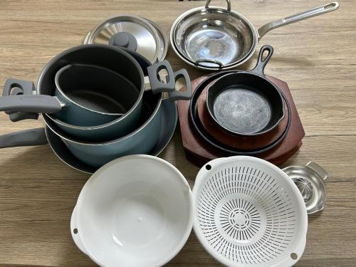 a bunch of pots and pans sitting on a table at COMMA House in Yokohama