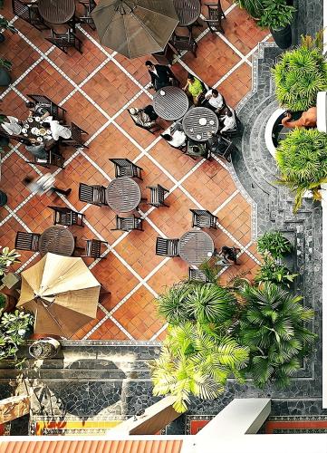 an overhead view of a patio with tables and chairs at CS Pattani Hotel in Ban Ru Sa Mi Lae
